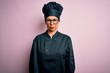 © Krakenimages.com - Middle age brunette chef woman wearing cooker uniform and hat over isolated pink background depressed and worry for distress, crying angry and afraid. Sad expression.