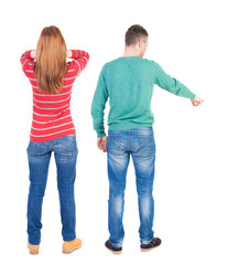 Wall Mural - Back view of couple in sweater pointing.