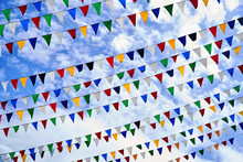 Colorful Bunting Flags On Blue Sky Background
