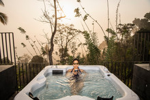 Woman Enjoying A Bath In A Hot Tub In The Sri Lankan Highlands