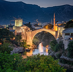 Wall Mural - Colorful sunset over the medieval bridge of Mostar on 11 August, 2019.