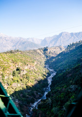 Scenic Aerial Scene - River between two mountains of himalayas, aerial view, crystal clear water
