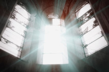 Light Through The Broken Windows Of The Ruined Church As A Symbol Of Faith, Christianity And The Immortality Of The Human Soul.