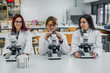 © Javier De La Torre/ADDICTIVE STOCK - Female scientists using microscopes in lab