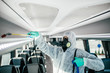 © hedgehog94 - Professional chemical cleaning of bus seats. Bus disinfection. Exterminator in workwear.