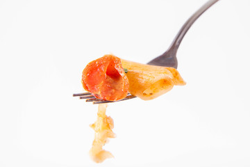 Sticker - Penne with tomatoes, garlic and mozzarella on a fork on a white background