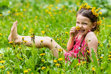 Girl posing with dandelions like a model