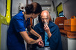 © Anna Kosolapova - A female doctor checking her patient's pulse and talking to him to comfort him