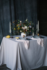 festive dining table with appliances for two and a beautiful wedding decor