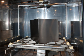 Sandblasting, Metal cube in a sandblasting cabinet.