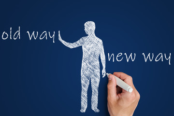 old way vs new way concept. man’s hand draws on a blue board a person who chooses instead of old actions - new solutions