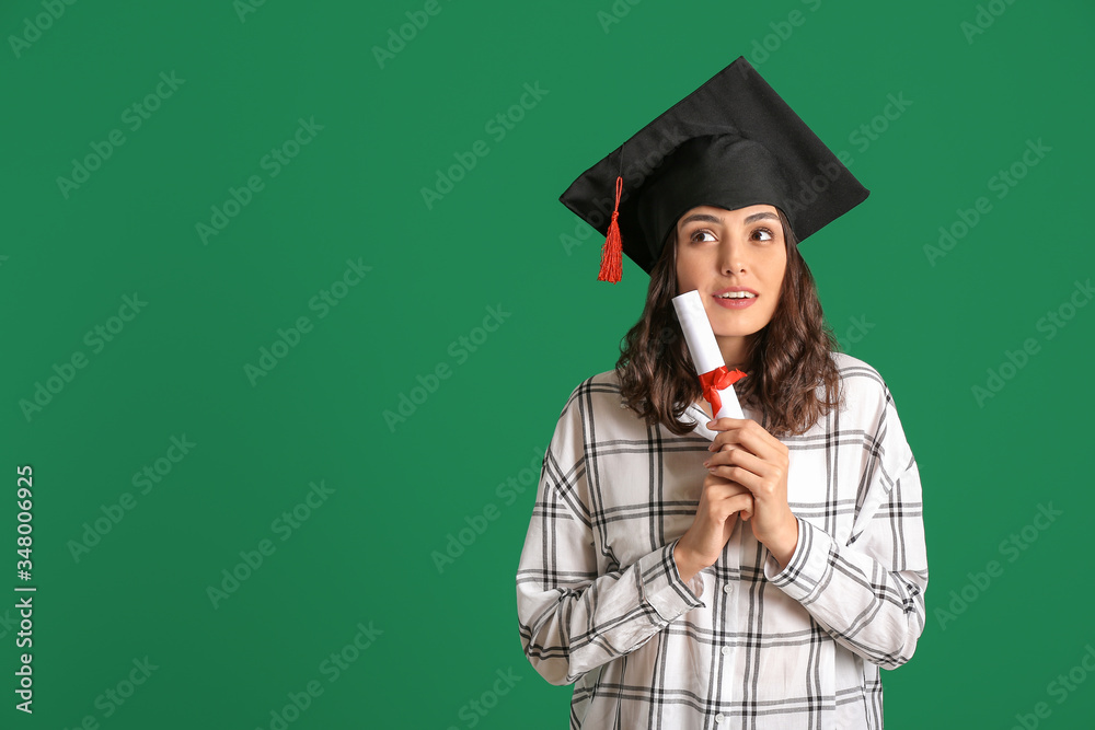 Female graduating student with diploma on color background