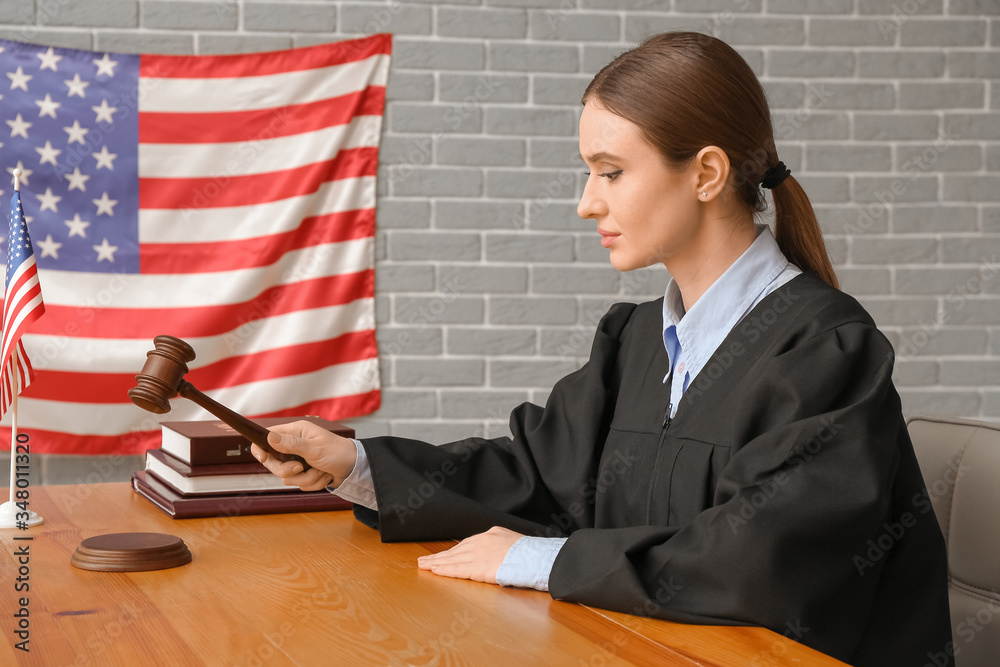 Female judge at table in courtroom