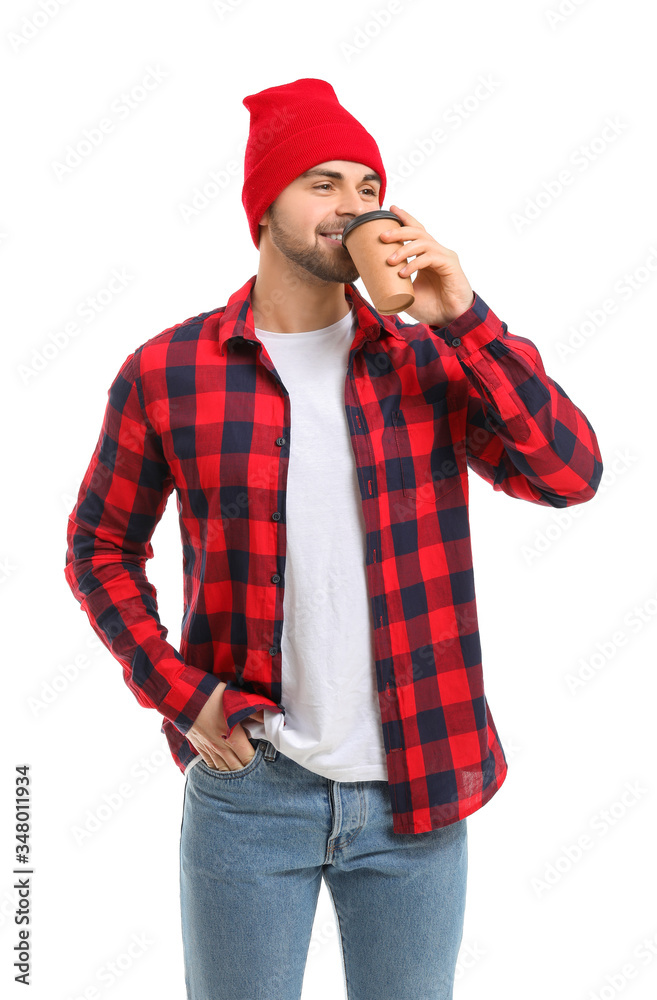 Young man with cup of hot coffee on white background