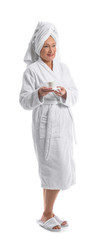 Poster - Mature woman in bathrobe and with cup of coffee on white background