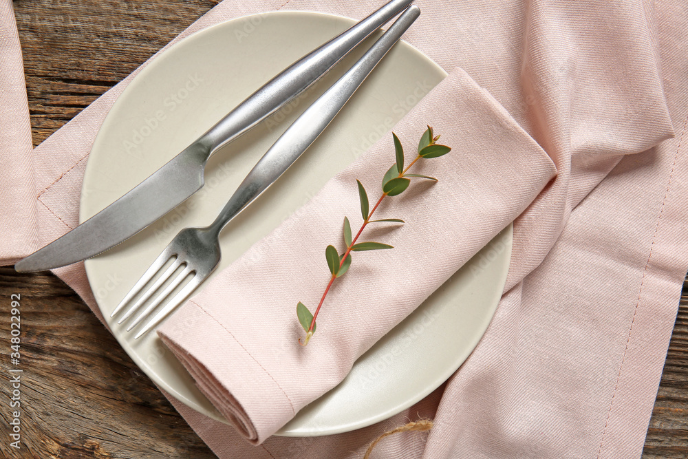 Beautiful table setting with floral decor on wooden background