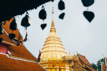 Wall Mural - Golden Chedi Spire at Wat Phra That Doi Suthep, Chiang Mai, Thailand, vintage film look.