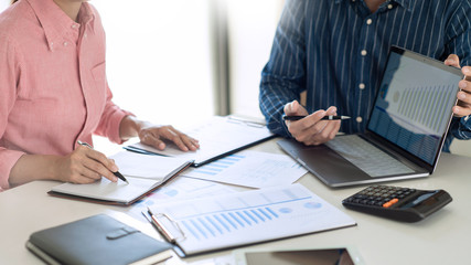 Canvas Print - Business team working with plan on office desk with new startup project analyzing financial document data charts and graphs in Meeting and successful teamwork Concept.