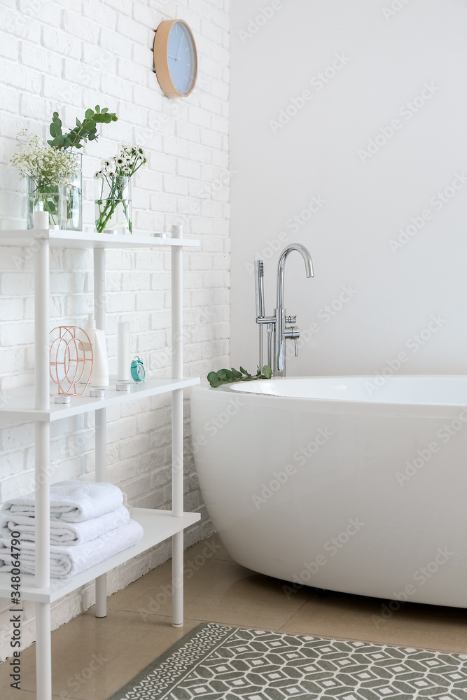 Interior of bathroom with floral decor