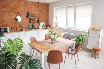 Interior of modern stylish dining room with floral decor