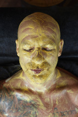 Wall Mural - Spa Face Mask. Skin Care Beauty Treatment. Relaxed Man On Natural Cosmetic Mud Facial Procedure.