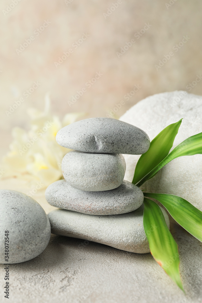 Stack of spa stones on light background