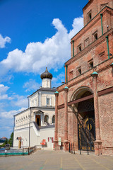 Wall Mural - Russia, Kazan June 2019. White Orthodox Church and red brick tower in the Kazan Kremlin.