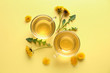 Cups of healthy dandelion tea on color background