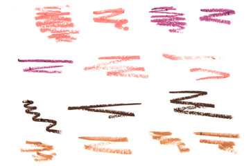 Wall Mural - Set of color cosmetic eyebrow and lip pencil strokes on paper, beauty product sample isolated on white background. - Image