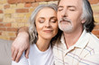© LIGHTFIELD STUDIOS - happy middle aged man and woman with closed eyes