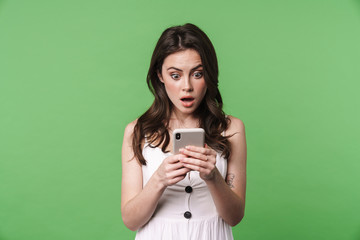 Sticker - Image of shocked woman expressing surprise and using cellphone