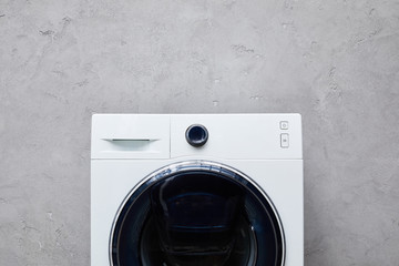 Wall Mural - white washing machine near grey textured wall in bathroom