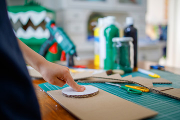 Sticker - Cardboard project , boys playing at home