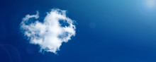 Cloud-shaped Heart On A Blue Spring Sky.