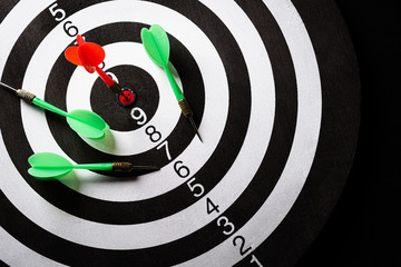 Canvas Print - Top view of the target dartboard with arrows on dark background, business marketing, success, growth up and winner concept.