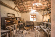 Abandoned Dirty House With Broken Roof Tiles And Wooden Beams At La Gomera, Canary Islands, Spain. Decayed Interior At Lost, Isolated, Creepy And Lonely Place. Trash On The Floor In Empty Horror Room