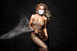 © ASjack - Beautiful blonde woman in face mask on black background.
