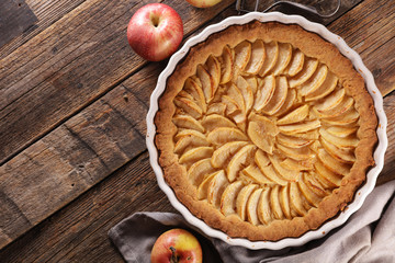 Wall Mural - homemade apple pie on wood background