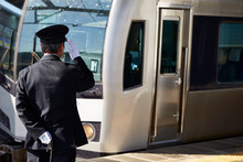 Japanese Train Conductor At Station 