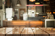 © DEEP PIXEL - Empty old wood table top with bokeh coffee shop interior background.