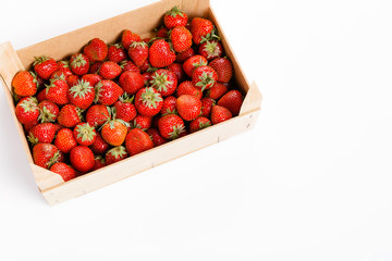 Wall Mural - Fresh strawberries in a wooden box on white background