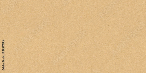 Fotografía High resolution seamless yellow cardboard background or texture hard paper sheet