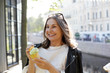 © shurkin_son - Cheerful overjoyed pleased mature woman with stylish black leather jacket on her shoulders laughing, having fun outdoors, enjoying tasty delicious ice cream in waffle cone, smiling broadly