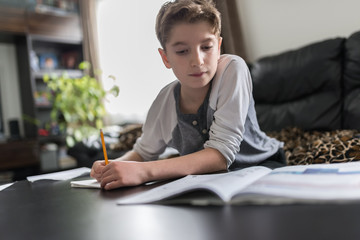 Kid studying from home amid COVID-19 coronavirus crisis