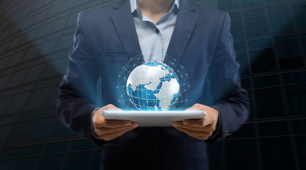 Poster - International business and technologies. Businessman holding tablet computer with Earth hologram, collage