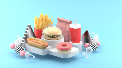 Hamburgers, hot dogs, donuts, french fries and soft drinks surrounded by colorful balls on a blue background.-3d rendering.