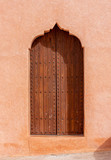 Fototapeta Desenie - Traditional Arabian architecture, muslim style wooden door and red clay wall
