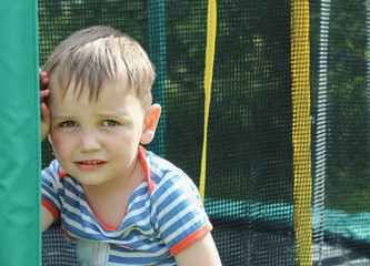 Sad little child on the Playground. The closure of the sports sections, the concept of anti-virus