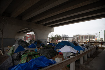 homeless camp under bridge no sign