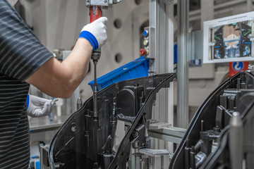 assembly of plastic molds on the production line in the factory